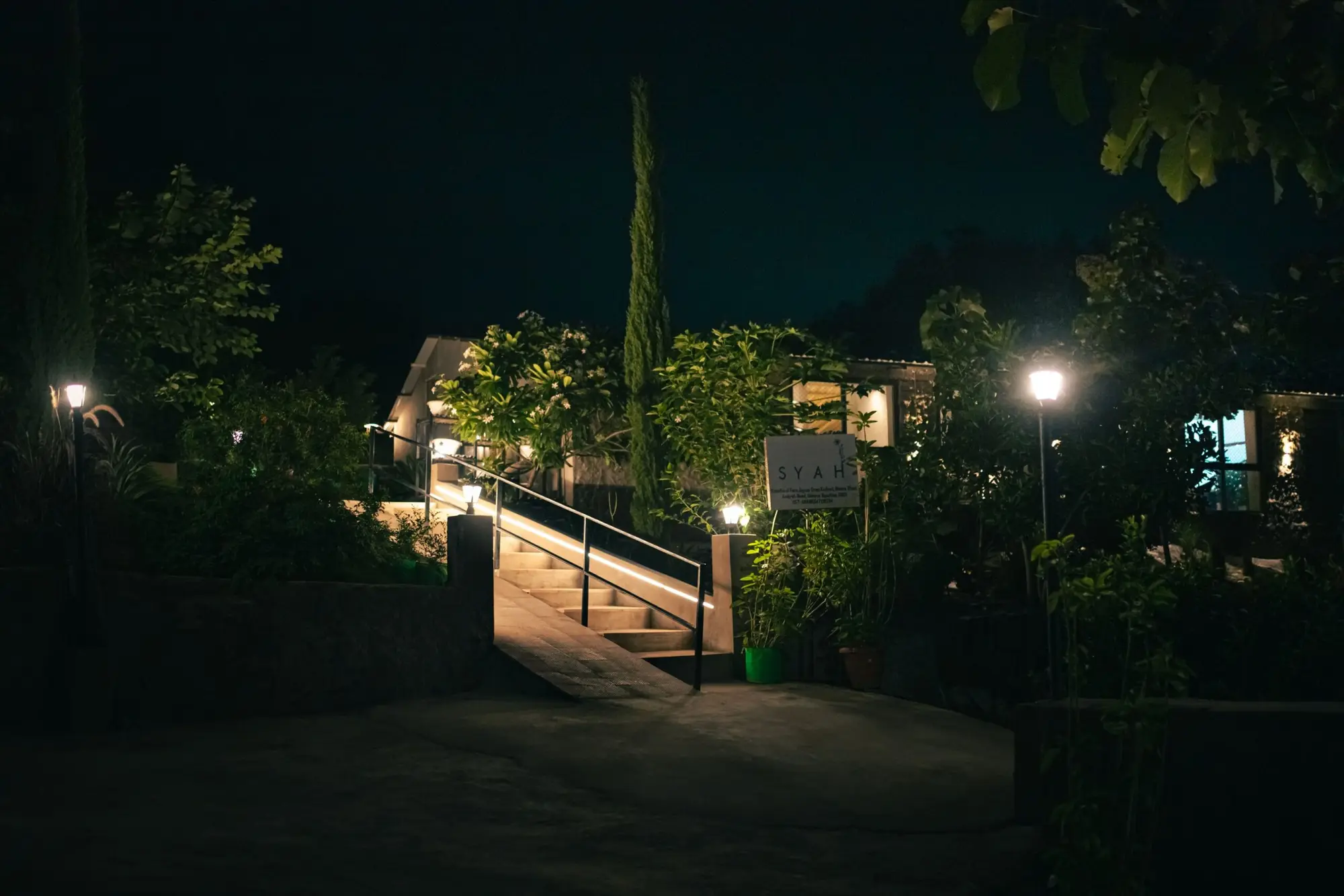 Syah's garden and entrance lit at night on Kasotia Ji Farm
